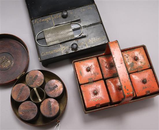 An early black tin spice tin and two similar in orange